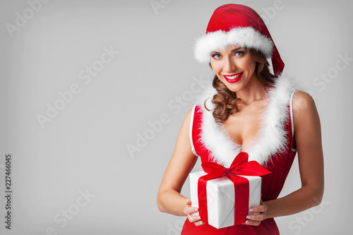 Woman in santa hat with gift