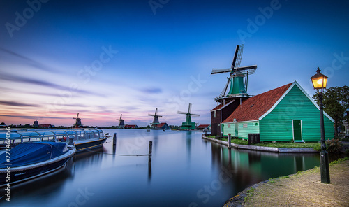 After sunset in Zaanse Schans Holland Netherlands, Windmills in background
