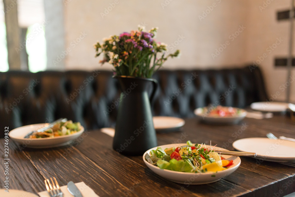 Fresh healty salad plate on wooden table Fresh healty salad plate on wooden table