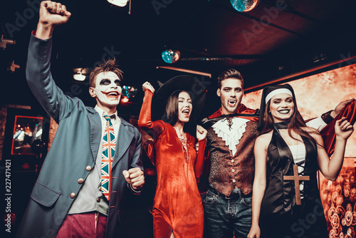 Group of Friends in Halloween Costumes Dancing