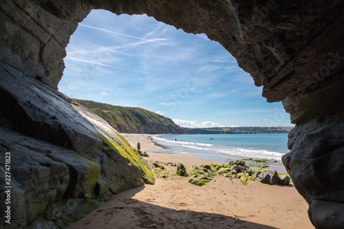 Inside a cave on a beach in West Wales photo