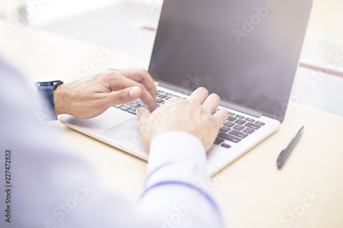 Businessman working on lapt...