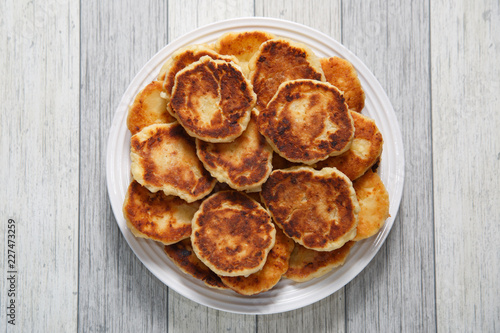 Delicious fried cheese cakes on a dish.