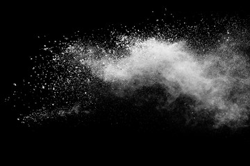 White powder explosion isolated on black background. 