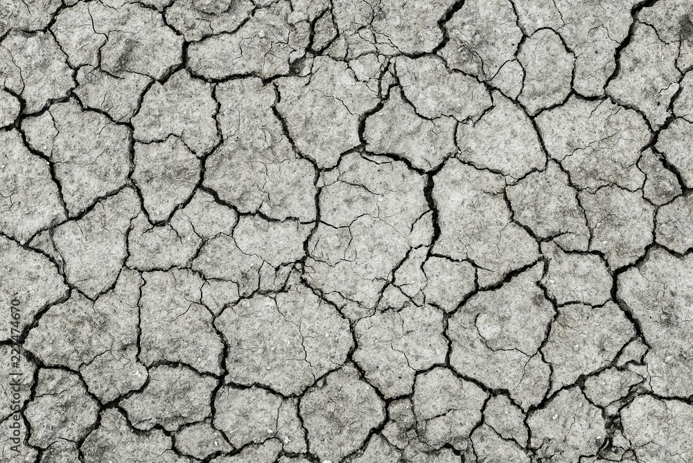 Cracked black earth parched earth close-up Cracked black earth parched earth close-up