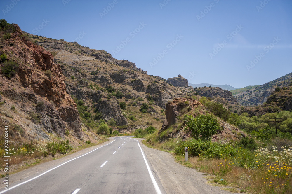 Winding road running through a beautiful mountain landscape