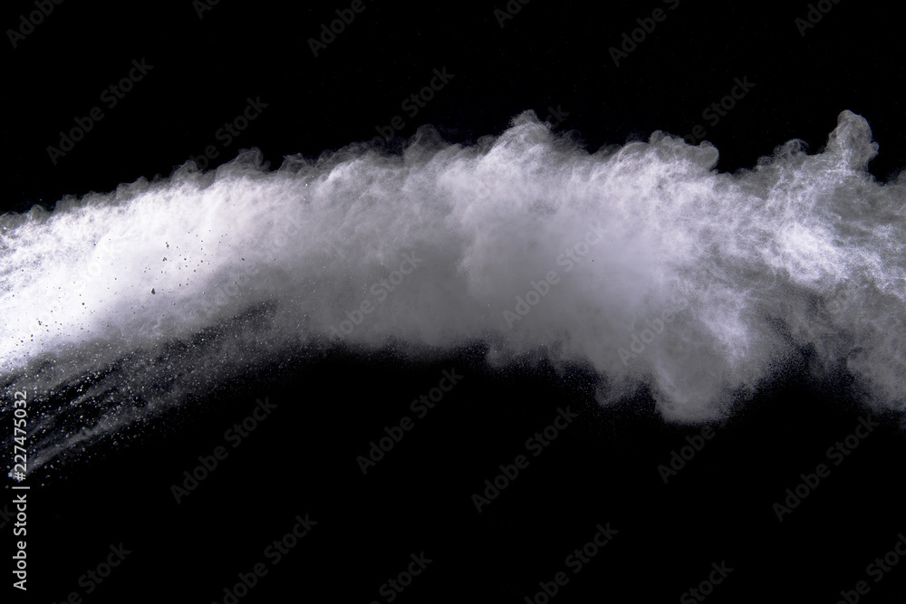 White powder explosion isolated on black background. White powder explosion isolated on black background.