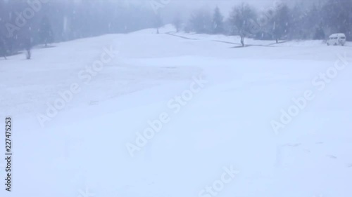 Snowfall in a white snow covered landscape