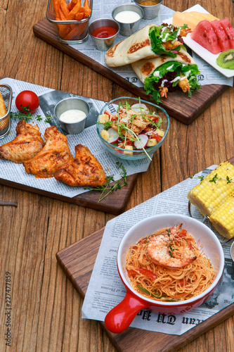 Spaghetti with Mexican chicken rolls and grilled chicken wings and salad