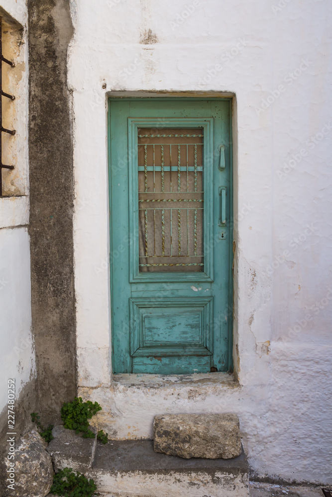 White building with a green door, Crete, Greece