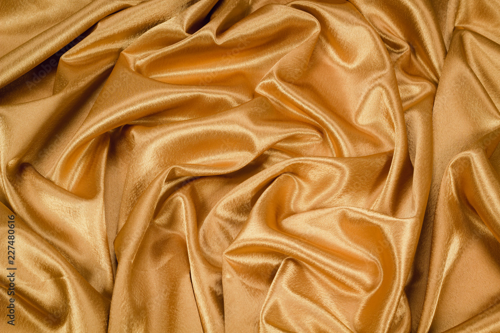 Fototapeta premium The fabric is crepe satin gold