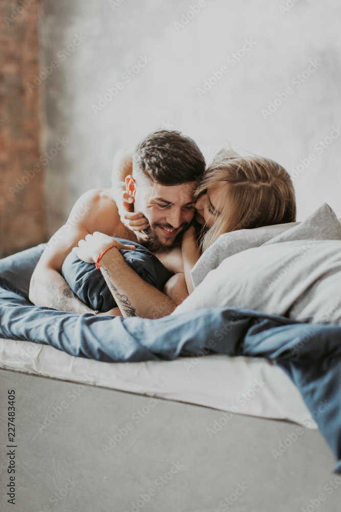 beautiful loving couple kissing in bed
beautiful loving couple kissing in bed