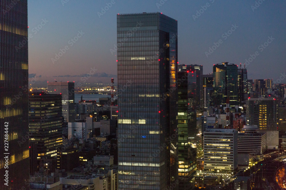 transportation and urban concept - view to tokyo city and railway station in japan at night transportation and urban concept - view to tokyo city and railway station in japan at night