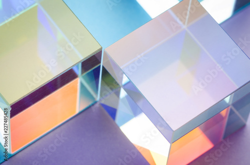 Multi-colored glowing glass cubes symmetry, abstract colorful background
