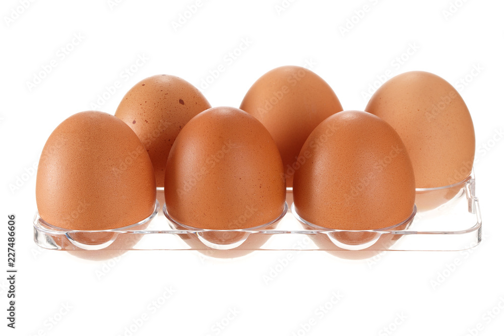 Eggs in transparent container from refrigerator isolated on white background Eggs in transparent container from refrigerator isolated on white background