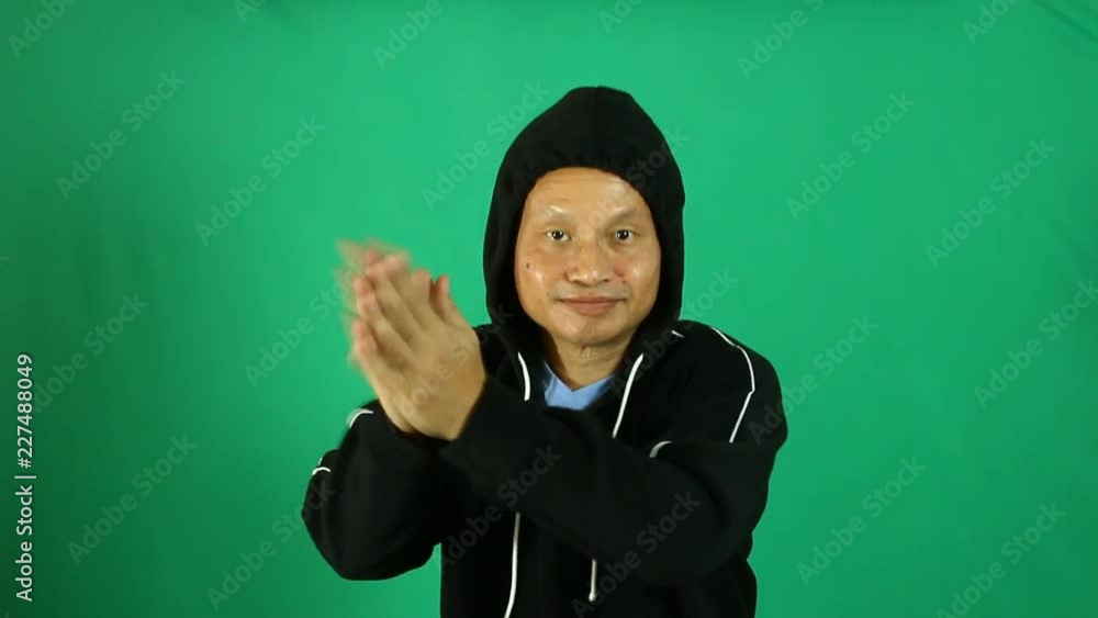 Thai man dancing with green background Thai man dancing with green background