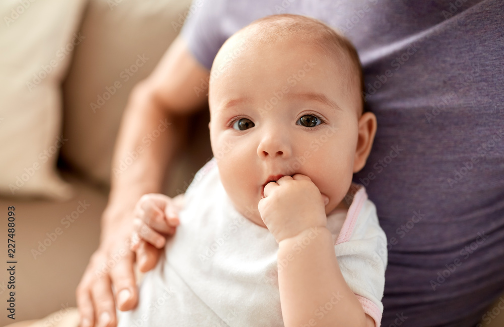 family, parenthood and people concept - close up of father with little baby girl at home family, parenthood and people concept - close up of father with little baby girl at home