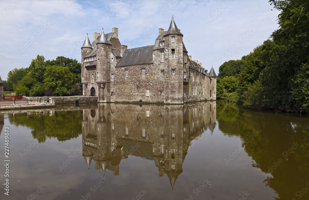 Chateau de Trecesson, mirrored in the clear waters of its moat