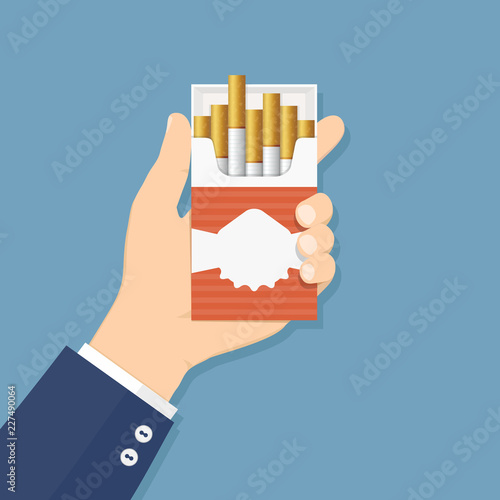 Hand holding cigarette pack, flat design vector illustration
