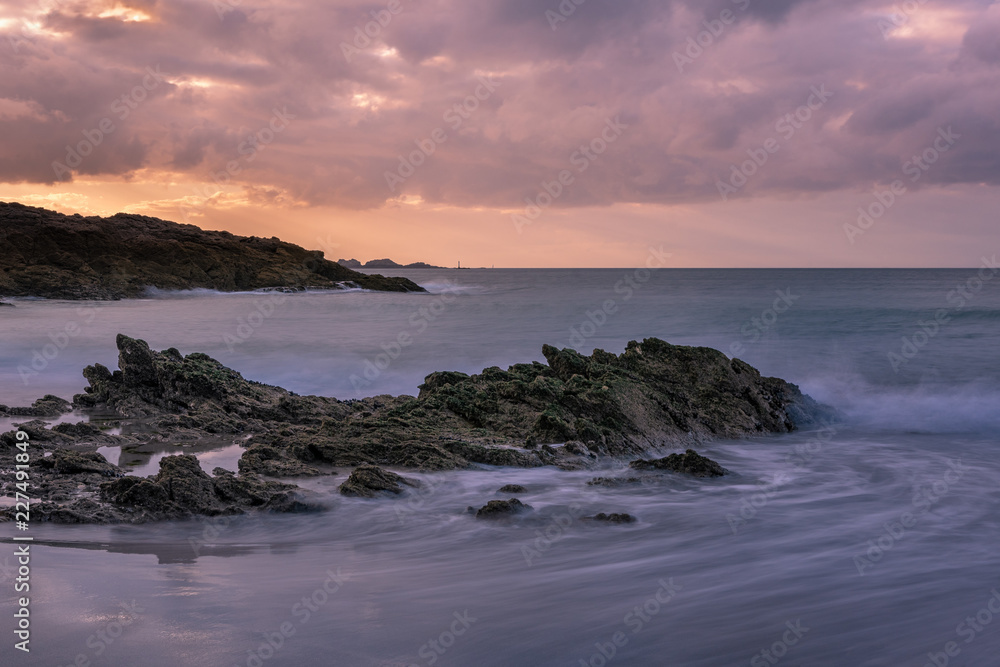 French landscape - Bretagne. A beautiful beach nearby Dinard with rocks at sunset.