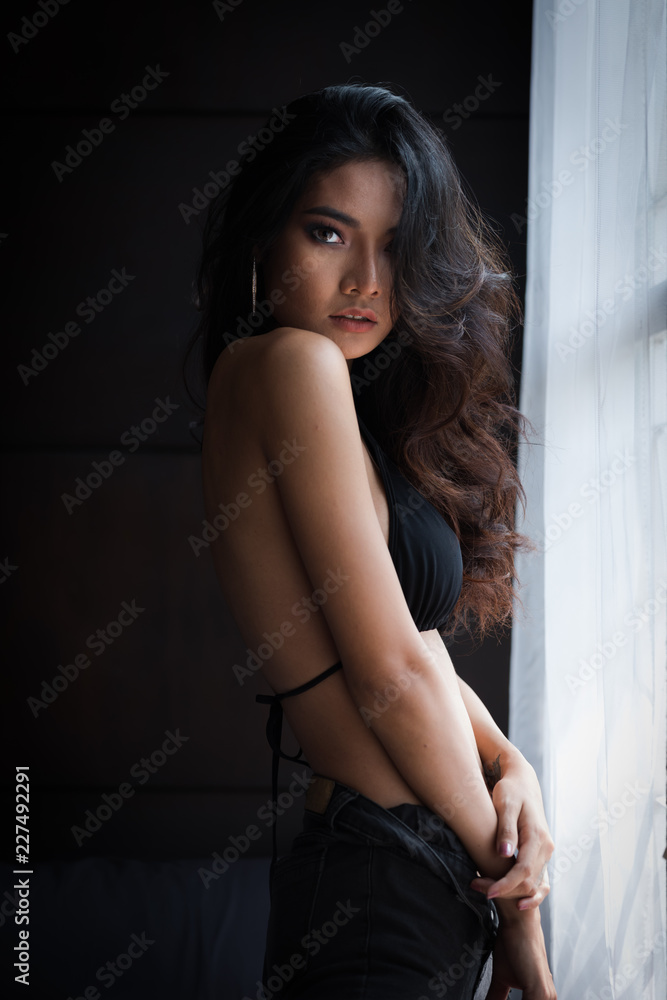 young woman asian girl sexy lady in black bra on the dark background Stock  Photo | Adobe Stock