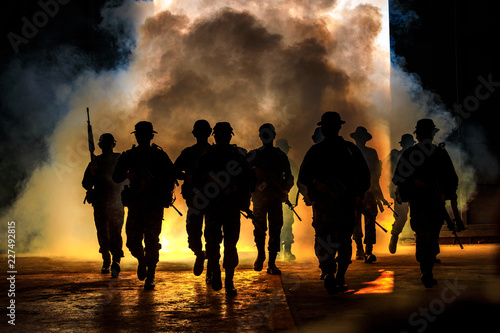 soldiers walkers carry weapon of fire photo