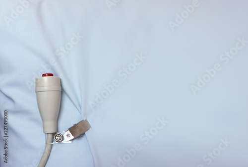 Medical emergency button on white sheet as copy space