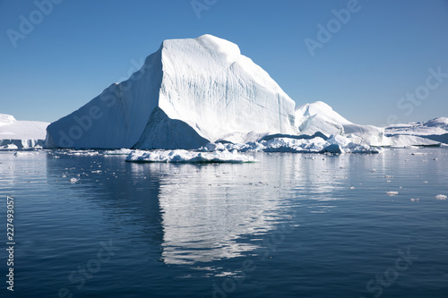 Massive iceberg in bright daylight during polar summer. Disko bay, Greenland.