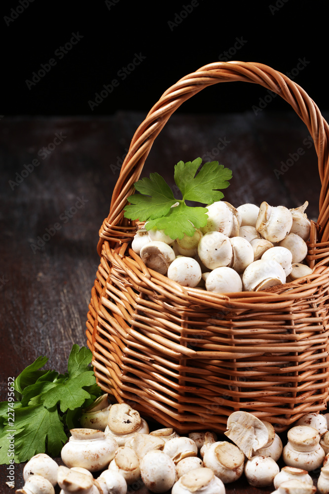 raw fresh mushrooms on rustic table. white fresh mushroom raw fresh mushrooms on rustic table. white fresh mushroom