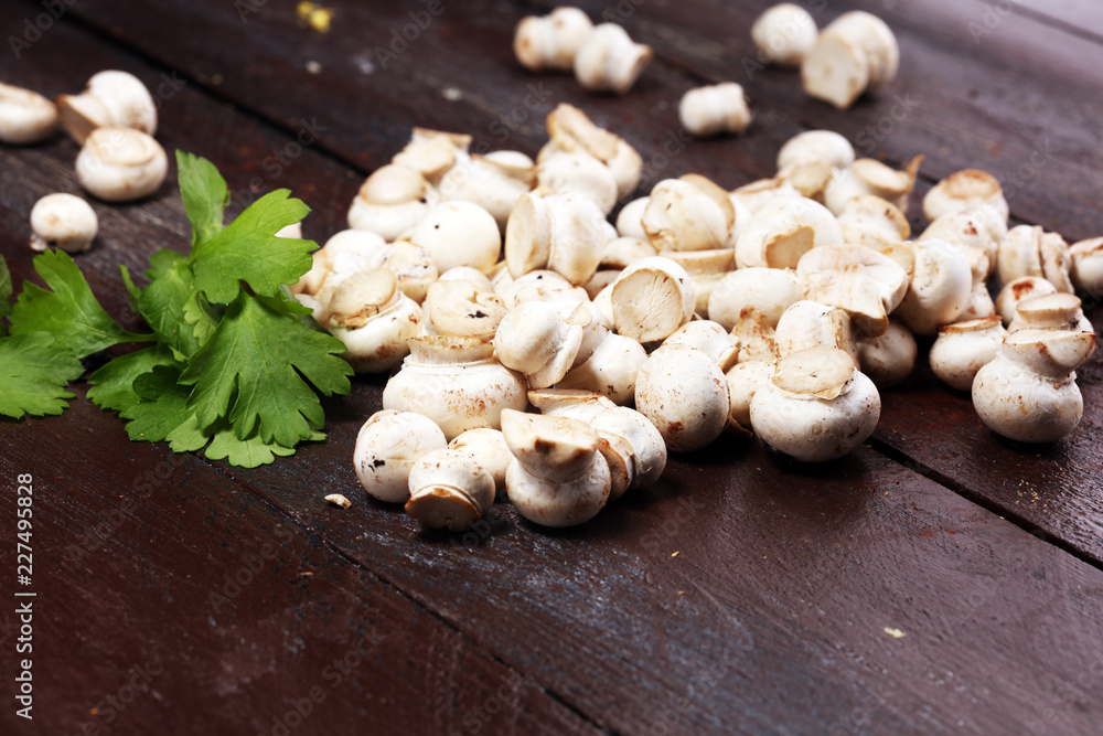 Fototapeta premium raw fresh mushrooms on rustic table. white fresh mushroom