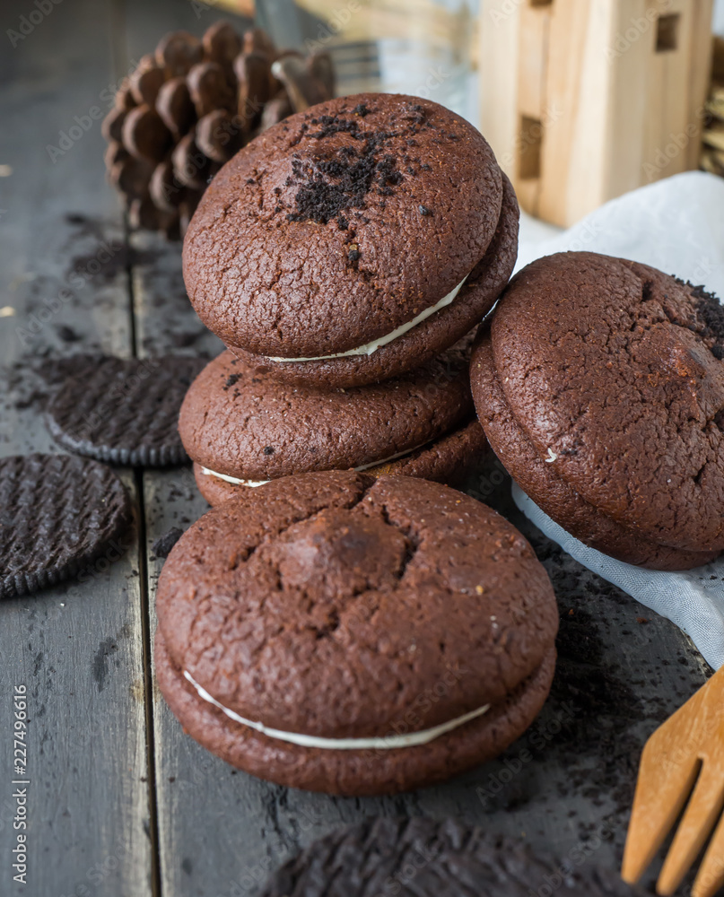 Chocolate cookies and brownie biscuit on black wood table. Chocolate cookies and brownie biscuit on black wood table.