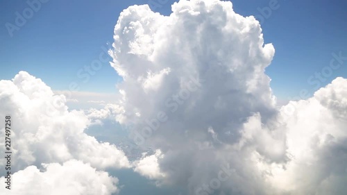 Flying with clouds, watching clouds from airplane window