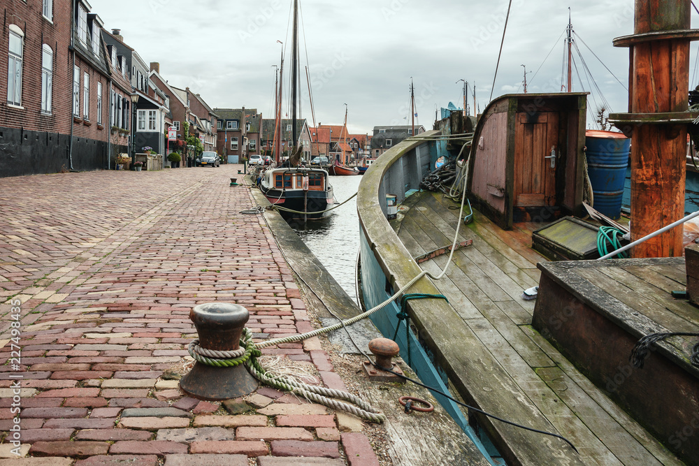 Moored ships in the harbor of the former fishing village Spakenburg in the Netherlands