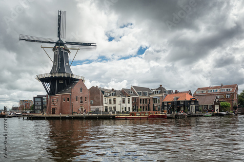 The eight-sided smock mill De Adriaan on the river De Spaarne in Haarlem © julia700702