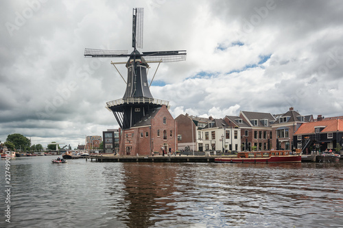 The eight-sided smock mill De Adriaan on the river De Spaarne in Haarlem