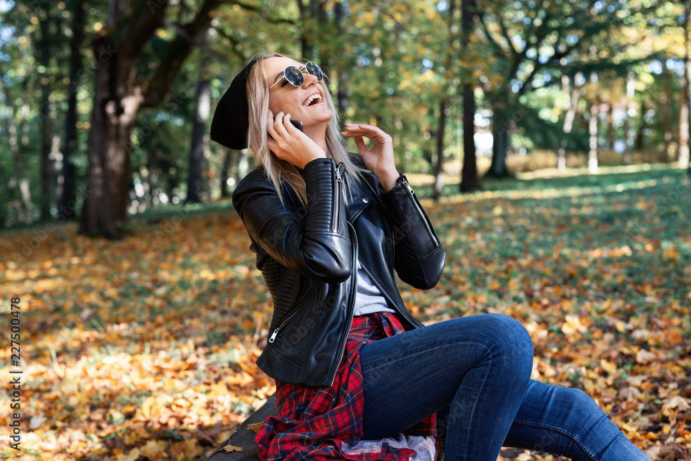 young woman enjoying autumn outdoors