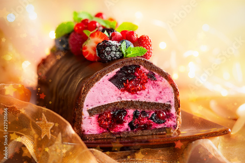 Chocolate and berries log cake.