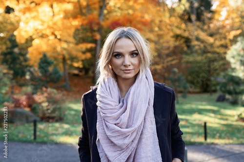 young woman enjoying autumn outdoors