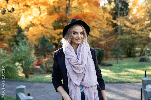 young woman enjoying autumn outdoors