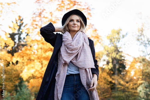 young woman enjoying autumn outdoors