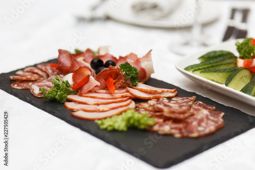 Dish with sliced meat products