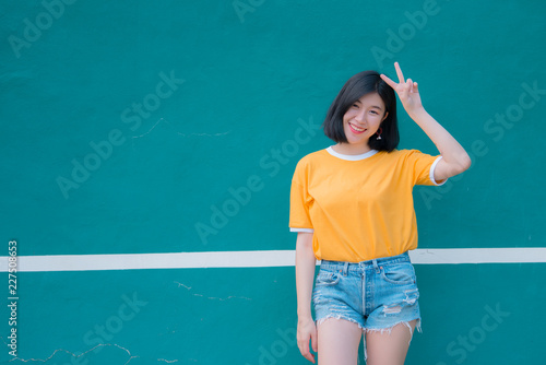 Portrait of beautiful asian chic girl pose for take a picture,Lifestyle of teen thailand people,Modern woman happy concept,Tennis couse, pastel tone © reewungjunerr