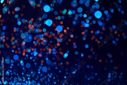 Fantastic blurry and bokeh dark blue theme background in the mystry cave.