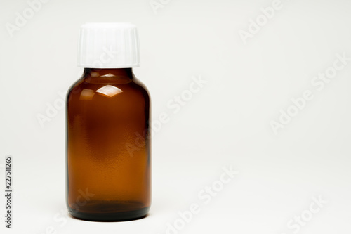 unlabelled empty medicine bottle 
