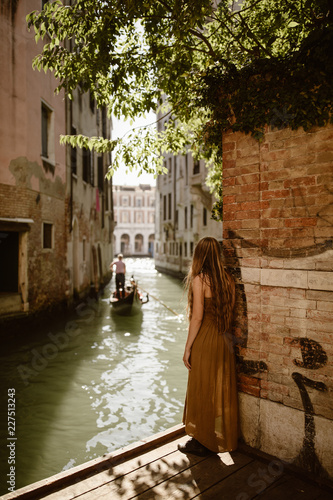 traveling woman in venice italy with long hair
