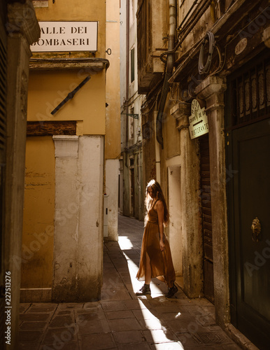 traveling woman in venice italy with long hair