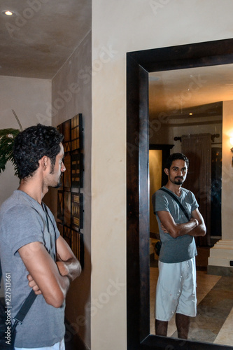 man looking in the mirror