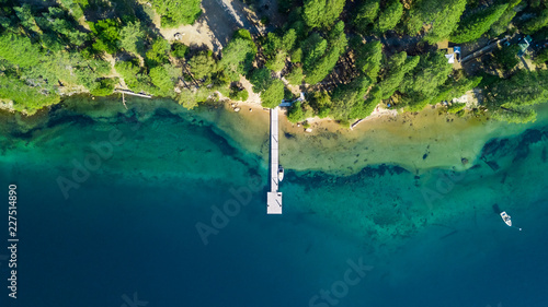 Drone view of the shore with a pontoon at Lake Tahoe California