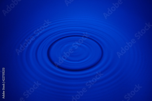 Closeup blue wave water rings macro, Circle reflections in pool.