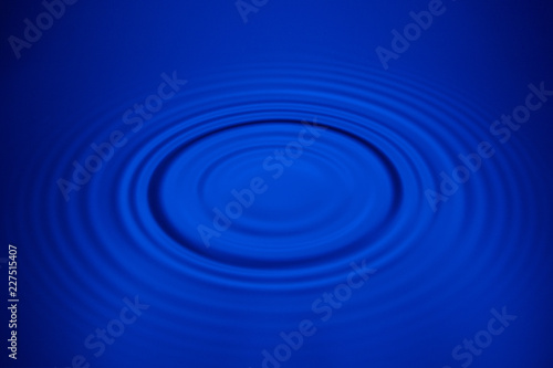 Closeup blue wave water rings macro, Circle reflections in pool.